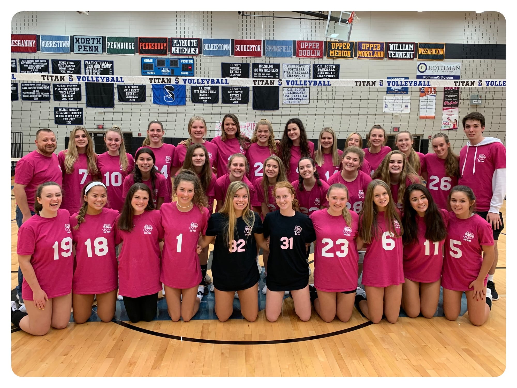 teams pose together on court