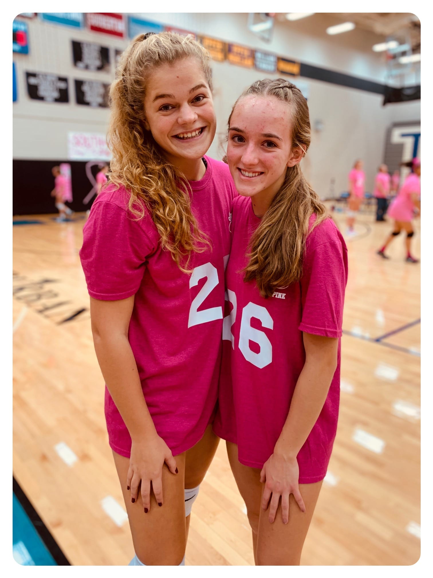 Players pose together at Dig Pink game